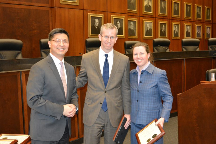 Beth Jantz and Daniel P. McLaughlin of the Federal Defender Program receiving an Award for Excellence in Public Interest Service from Judge Edmond E. Chang.