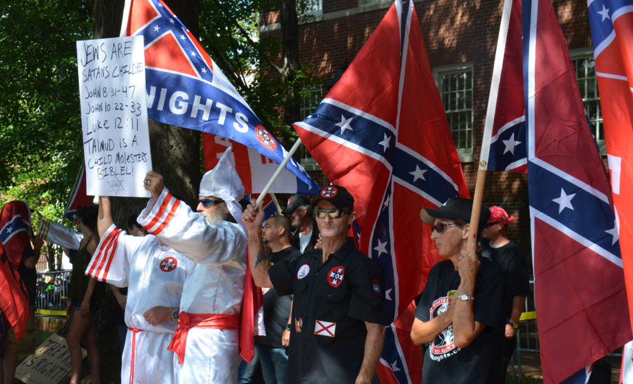Ku Klux Klan members rallied in Jackson Park Saturday in Charlottesville, Va. Several hundred people came out to watch and protest the rally.